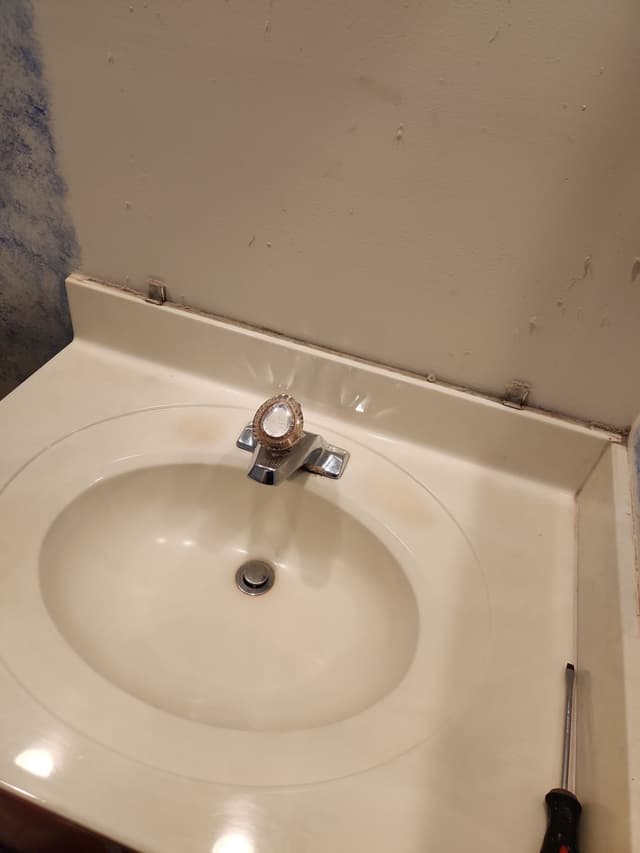 Outdated Vanity and Sink Area